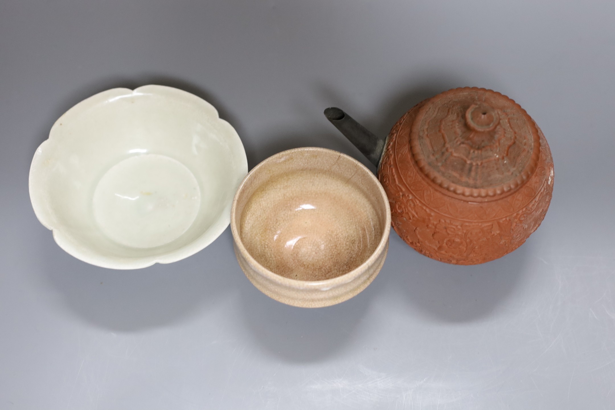 A Chinese Yixing teapot, 12cm tall, and two other Chinese ceramic bowls